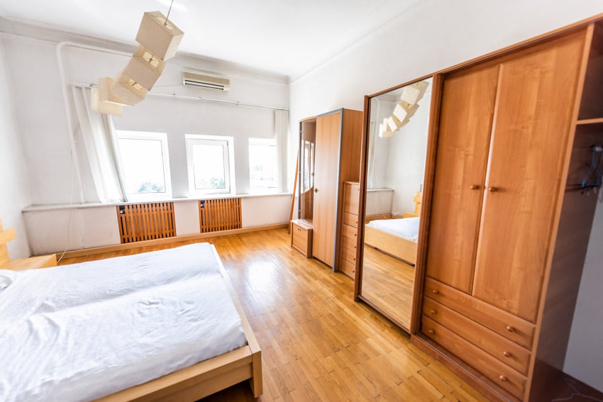 Bedroom with mirror and armoire