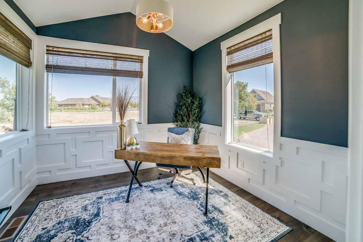 corner of home interior with chair rail and windows
