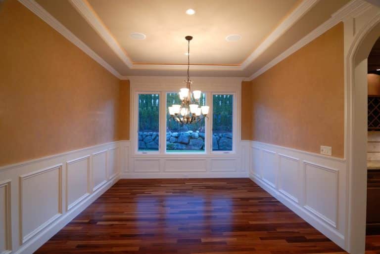 empty room with chair rail molding and wood floor
